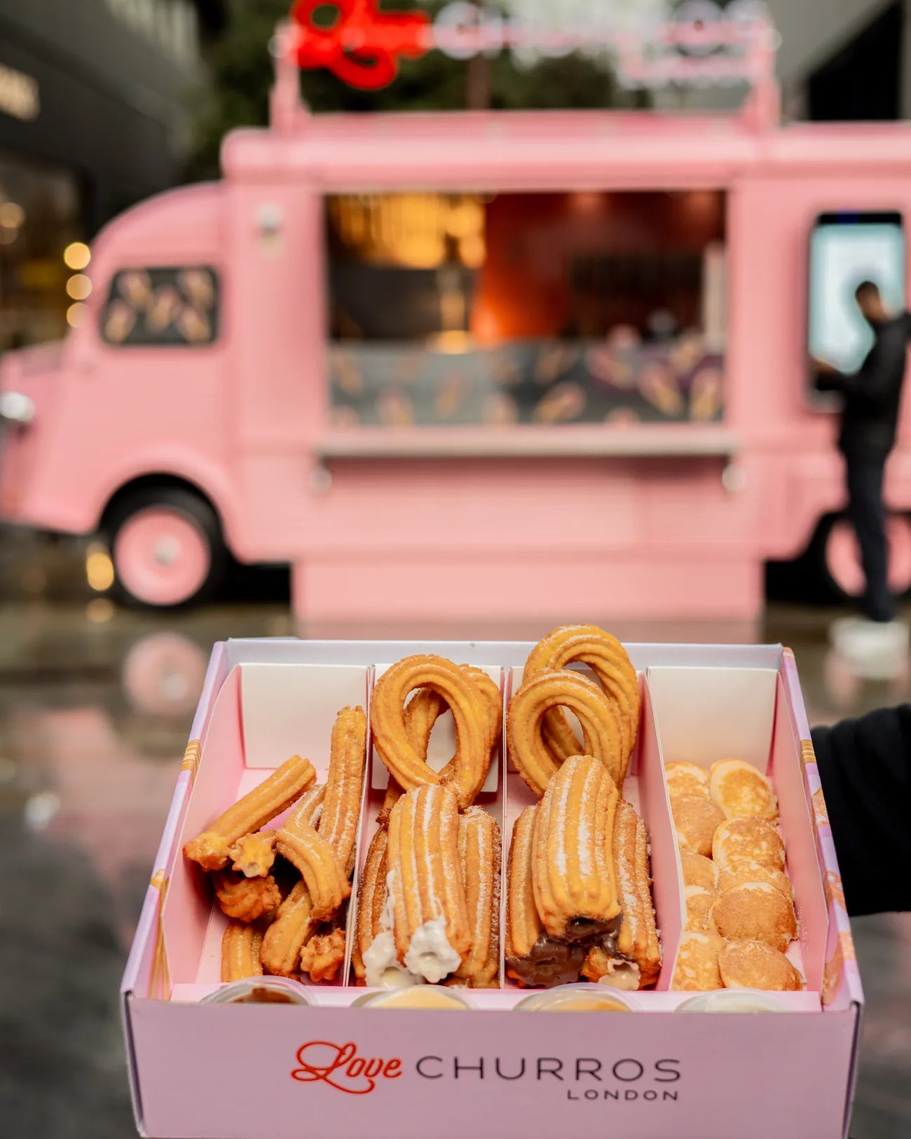 A Love Churros family box of churros, mini pancakes and dipping sauces